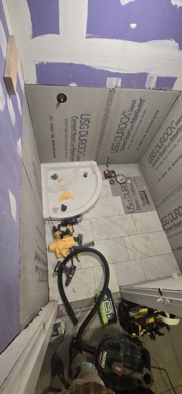 Bathroom tile floor and cement board installation in progress by BAX