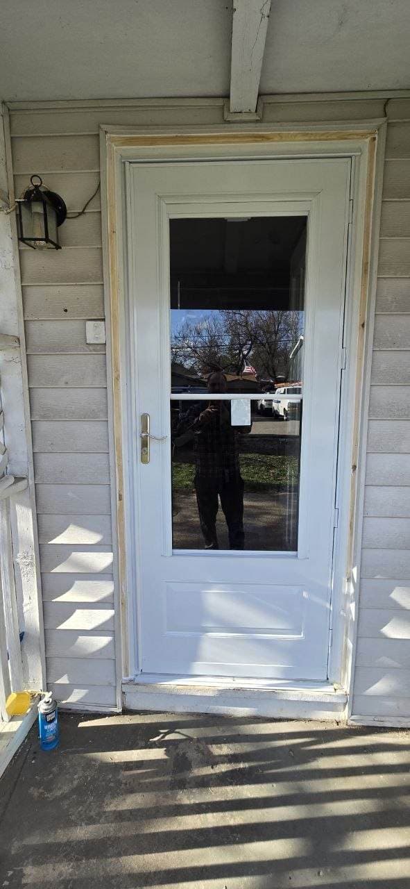 White front entry door installed with exterior trim work by BAX in Hoffman Estates